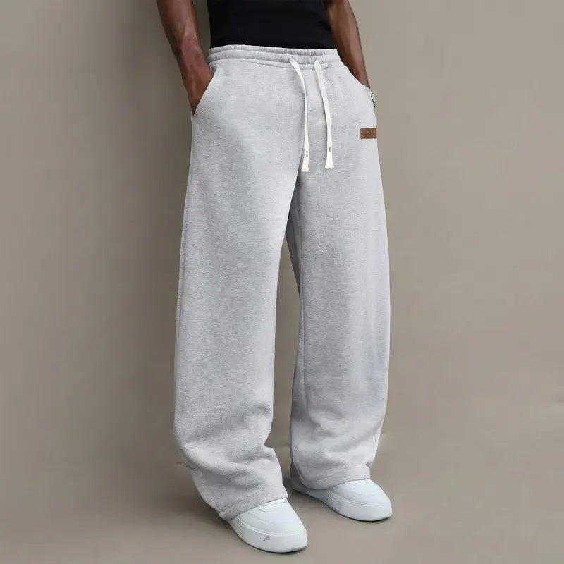 Men's casual pants for autumn, cotton-blendstretch fabric, comfortable athletic-casual longpants with a loose straight fit; suitable foreveryday wear and commuting; versatilesweatpants with drawstring; simple men'scasual pants.