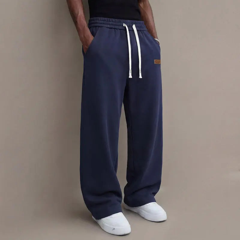 Men's casual pants for autumn, cotton-blendstretch fabric, comfortable athletic-casual longpants with a loose straight fit; suitable foreveryday wear and commuting; versatilesweatpants with drawstring; simple men'scasual pants.