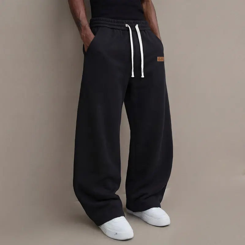Men's casual pants for autumn, cotton-blendstretch fabric, comfortable athletic-casual longpants with a loose straight fit; suitable foreveryday wear and commuting; versatilesweatpants with drawstring; simple men'scasual pants.
