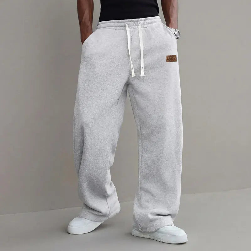 Men's casual pants for autumn, cotton-blendstretch fabric, comfortable athletic-casual longpants with a loose straight fit; suitable foreveryday wear and commuting; versatilesweatpants with drawstring; simple men'scasual pants.